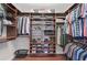 Spacious walk-in closet featuring custom wood shelving, hanging rods, and ample storage for clothes, shoes, and accessories at 641 Bayshore Rd, Nokomis, FL 34275