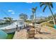 Waterfront views from the patio with nearby chairs to sit and relax at 641 Bayshore Rd, Nokomis, FL 34275