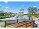 View of the boat on the dock, with easy access to the waterfront at 641 Bayshore Rd, Nokomis, FL 34275