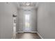 Interior entryway with gray walls and wood-look tile flooring at 7057 Regina Dr, Englewood, FL 34224