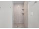 Large walk-in shower with tiled walls and a built in seat at 7057 Regina Dr, Englewood, FL 34224