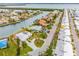 Aerial view showing waterfront home with circular driveway at 721 Binnacle Point Dr, Longboat Key, FL 34228