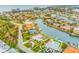 Aerial view of waterfront property with pool and circular driveway at 721 Binnacle Point Dr, Longboat Key, FL 34228