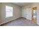 Well-lit bedroom with carpet flooring and double door closet at 5113 Hablow Ln, North Port, FL 34286