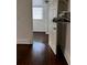 A bedroom with hardwood floors, window, and closet shelves at 510 26Th St S, St Petersburg, FL 33712