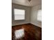 A bright bedroom featuring beautiful hardwood floors at 510 26Th St S, St Petersburg, FL 33712