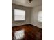 A bright bedroom featuring beautiful hardwood floors at 510 26Th St S, St Petersburg, FL 33712