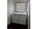 A functional laundry room features a side-by-side washer and dryer, and natural light from a window at 510 26Th St S, St Petersburg, FL 33712