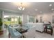 Bright dining room with glass table and seating for six at 25503 Calusa Dr, Punta Gorda, FL 33955
