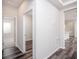 Clean hallway with wood-look flooring, leading to other rooms at 25503 Calusa Dr, Punta Gorda, FL 33955