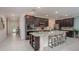 Open concept kitchen with large island and breakfast bar at 25503 Calusa Dr, Punta Gorda, FL 33955
