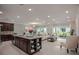 Open floor plan with kitchen island and adjoining living room at 25503 Calusa Dr, Punta Gorda, FL 33955