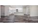Open concept living room and kitchen with hardwood floors at 25503 Calusa Dr, Punta Gorda, FL 33955