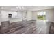 Spacious living area with hardwood floors and large windows at 25503 Calusa Dr, Punta Gorda, FL 33955