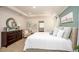 Main bedroom with dresser, seating area and large bed at 25503 Calusa Dr, Punta Gorda, FL 33955