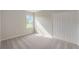 Well-lit bedroom featuring carpet and a closet at 25491 Calusa Dr, Punta Gorda, FL 33955