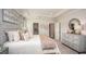Spacious bedroom with large bed, dresser, and calming decor at 25488 Calusa Dr, Punta Gorda, FL 33955