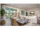 Casual dining area with sliding glass doors and wicker chairs at 25488 Calusa Dr, Punta Gorda, FL 33955