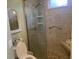 Walk-in shower with grab bars and tiled walls at 7234 Cedar Hollow Cir # 7234, Bradenton, FL 34203