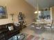 Open concept living and dining area with a view into the kitchen at 7234 Cedar Hollow Cir # 7234, Bradenton, FL 34203