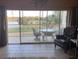 Living room with sliding doors and view of golf course at 7234 Cedar Hollow Cir # 7234, Bradenton, FL 34203