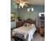 Serene bedroom with a ceiling fan and ensuite bathroom access at 7234 Cedar Hollow Cir # 7234, Bradenton, FL 34203