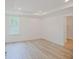 Bright bedroom with hardwood floors and access to closet at 25533 Calusa Dr, Punta Gorda, FL 33955
