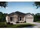 Two-story house with stone accents and a two-car garage at 25533 Calusa Dr, Punta Gorda, FL 33955