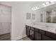 Double vanity bathroom with dark brown cabinets at 1372 Hartsdale St, North Port, FL 34287