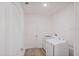 Bright laundry room with washer and dryer and extra storage at 1372 Hartsdale St, North Port, FL 34287