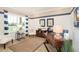 Home office with built-in desk and comfortable seating at 3194 Cabo St, North Port, FL 34291