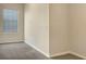 Simple bedroom with grey carpet and a window with blinds at 530 Glenn Cross Dr, Ruskin, FL 33570