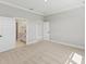 Primary bedroom with ensuite bathroom and neutral decor at 522 Sun Chaser Dr, Nokomis, FL 34275