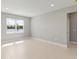 Spacious bonus room with large window and light tile floors at 522 Sun Chaser Dr, Nokomis, FL 34275