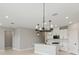 Open concept kitchen with an island and modern light fixture at 522 Sun Chaser Dr, Nokomis, FL 34275