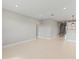 Spacious living room with light grey walls and light wood flooring at 522 Sun Chaser Dr, Nokomis, FL 34275