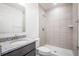 Bathroom featuring a granite vanity and tiled shower at 5637 Ocarina Rd, North Port, FL 34291