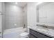 Bathroom featuring a granite vanity, tiled shower and tub at 5637 Ocarina Rd, North Port, FL 34291