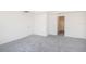 Cozy bedroom with soft gray carpet, white walls, and a closet at 5637 Ocarina Rd, North Port, FL 34291