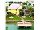 Aerial view of waterfront property with private dock and community pool at 9715 Harrell Ave # 40, Treasure Island, FL 33706