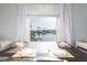Bright dining room with water views and elegant chandelier at 9715 Harrell Ave # 40, Treasure Island, FL 33706