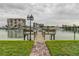 Private dock with brick pathway, offering scenic waterfront views at 9715 Harrell Ave # 40, Treasure Island, FL 33706