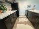 Updated kitchen featuring dark wood cabinets and white countertops at 9715 Harrell Ave # 40, Treasure Island, FL 33706