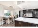 Modern kitchen with white countertops and dark cabinets at 9715 Harrell Ave # 40, Treasure Island, FL 33706