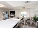 Modern kitchen with island and open concept to dining area at 9715 Harrell Ave # 40, Treasure Island, FL 33706