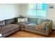 Comfortable living room with a large sectional sofa and plenty of natural light at 9715 Harrell Ave # 40, Treasure Island, FL 33706