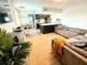 Open living space with contemporary furniture and kitchen at 9715 Harrell Ave # 40, Treasure Island, FL 33706