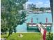 Scenic waterfront view with private dock and lush landscaping at 9715 Harrell Ave # 40, Treasure Island, FL 33706