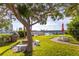 Community waterfront area with picnic tables and fire pit at 9715 Harrell Ave # 40, Treasure Island, FL 33706