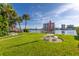 Relaxing waterfront area with picnic tables and lush grass at 9715 Harrell Ave # 40, Treasure Island, FL 33706